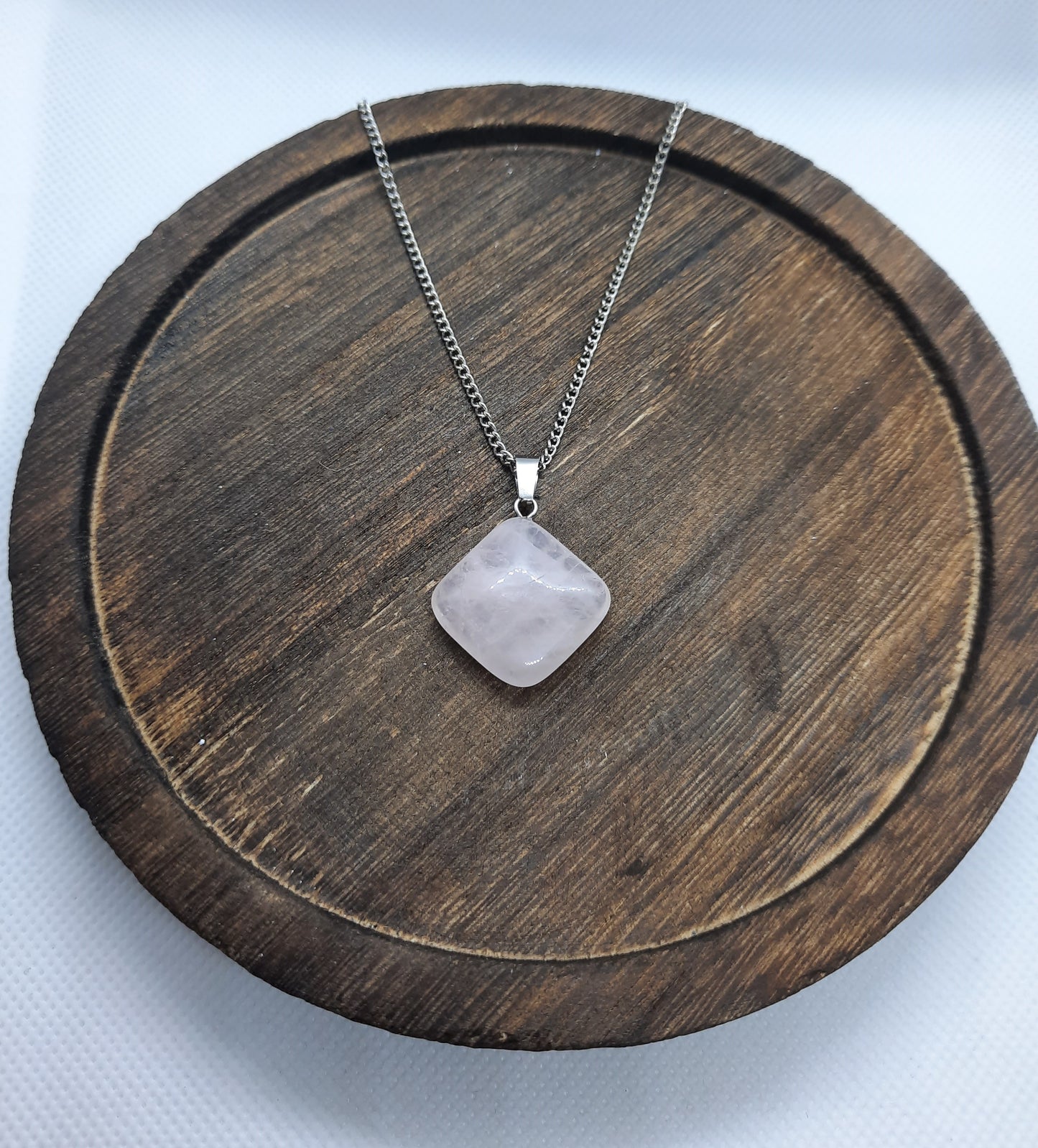Silver-colored necklace with rose quartz pendant