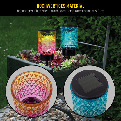 Zonne -decoratieve spiesjes "Mila" 2 set, Ø 8,3 cm, 25 cm hoog, zwart metaal, zwaar, gestructureerd glas in rood/geel en in blauw/groen, geïntegreerd LED, warm wit