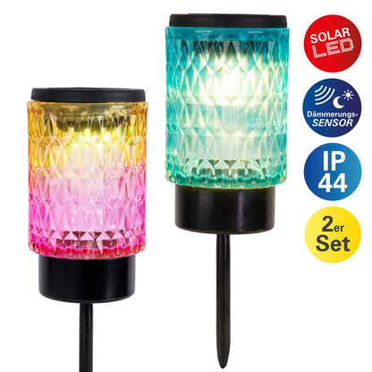 Zonne -decoratieve spiesjes "Mila" 2 set, Ø 8,3 cm, 25 cm hoog, zwart metaal, zwaar, gestructureerd glas in rood/geel en in blauw/groen, geïntegreerd LED, warm wit