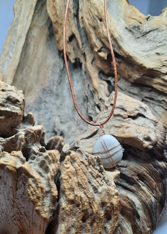 Brown leather necklace with a gray natural stone pendant