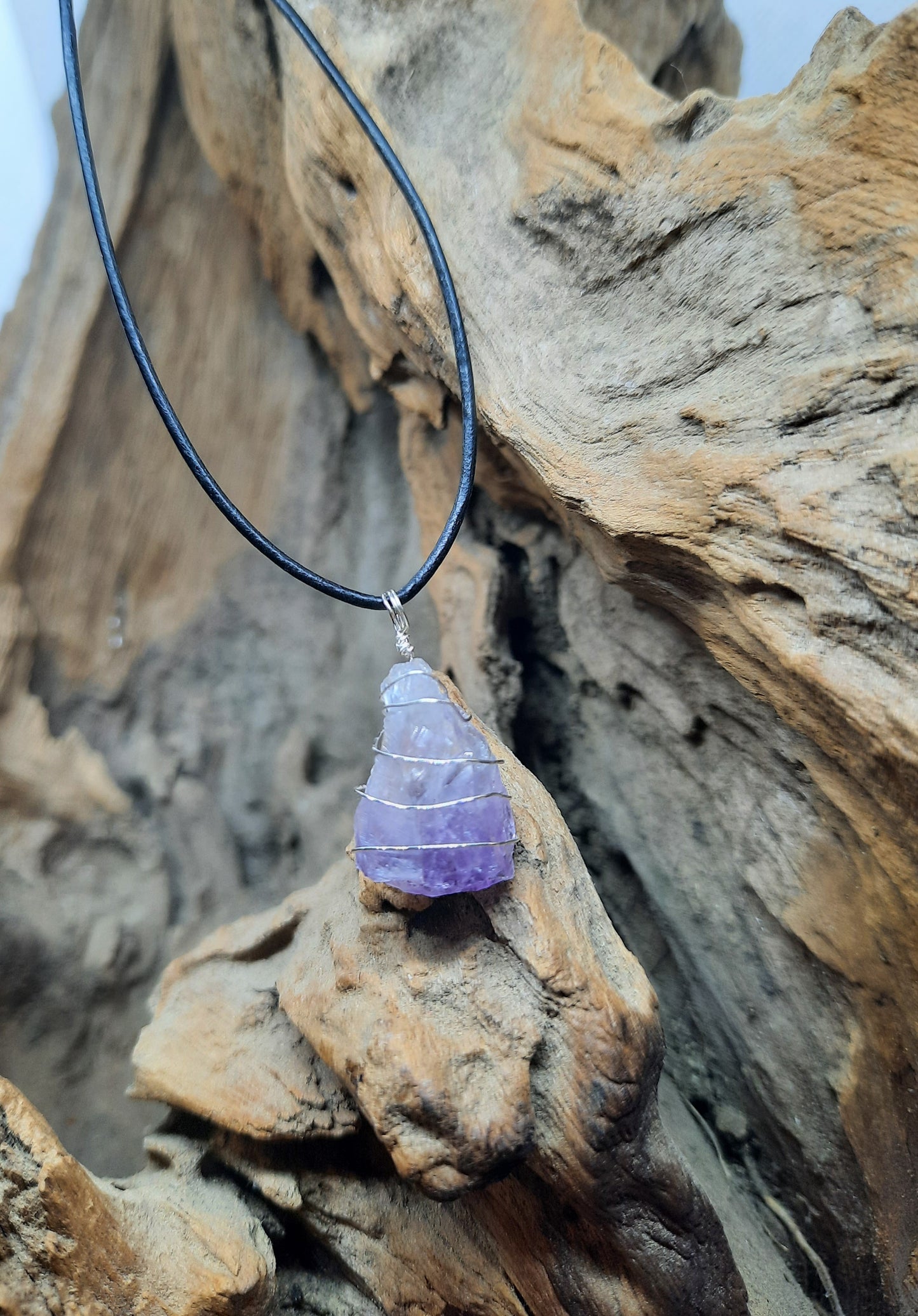Black leather necklace with amethyst pendant